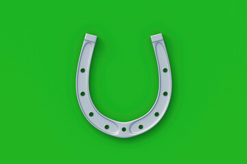 Silver horseshoe on a green background. Symbol of luck. Successful concept. Top view. Copy space. 3d render