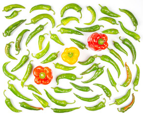 green hot peppers and red and yellow bell peppers on a white background. vitamin vegetables for...