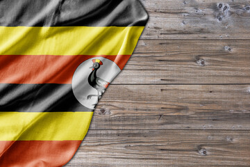 Wooden pattern old nature table board with Uganda flag