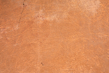 Orange wall outdoors. Background picture.Sample of Panted aged Concrete surface with terracotta plaster. Wallpaper textured picture. top view. 