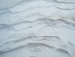 Striations of snow and sand background texture