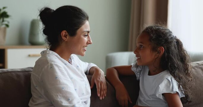 Caring Indian mother teach her little 6s daughter to pronounce words correctly. Professional speech-language pathologists therapist teach preschool girl with speech disorder. Kid development concept