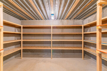 Unfinished food storage at the basement with concrete walls
