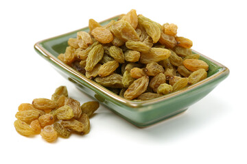 green raisin stacked together on white background