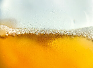 Glass with cold drink beer with condensation ice cool beverage background