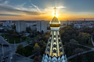 Russian orthodox church in Germany - sunset with sunflare on cross - Drone Aerial Shot Leipzig 