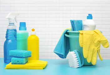 Cleaners and detergents in bucket, accessories for cleaning various surfaces and rooms blue...