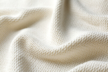 Beautiful white knitted fabric as background, closeup