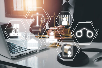 Justice and law concept, Male judge reading legal books working with VR screen law icon background.