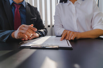 Fototapeta premium Businessman consulting with real estate broker about insurance broker contract agreement for home insurance, home buying and selling ideas and insurance
