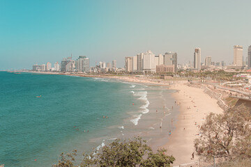Coastline of city Tel Aviv in Israel with beach and sea on sunny summer day.