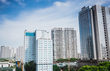 Fototapeta na wymiar High-rise buildings in Hanoi in the blue sky. Including concrete and glass buildings and buildings under construction. 