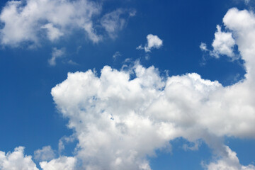 Bright blue sky with white clouds