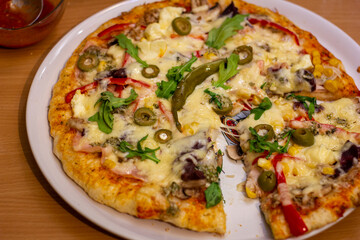 Pizza, pizza on a desk, pizza on a table, pizza with olives, Italian pizza, peperoni pizza