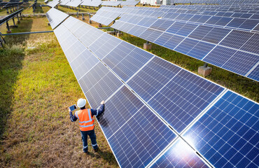 The solar farm(solar panel) with engineers check the operation of the system, Alternative energy to...