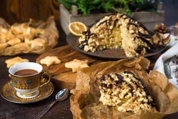 Anthill cake sprinkled with chocolate. Soviet food. Sweet pastry. Homemade baked village food.