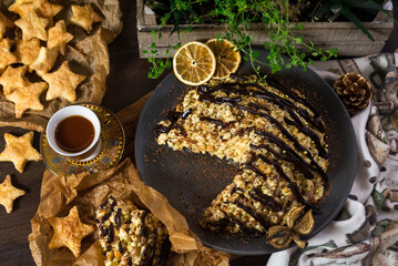 Anthill cake sprinkled with chocolate. Soviet food. Sweet pastry. Homemade baked village food.