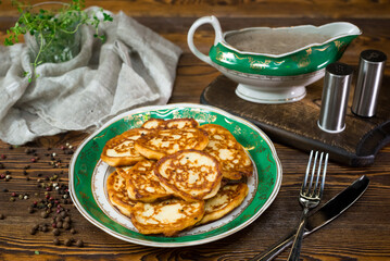 Potato pancakes with mushroom sauce. Home cooked pancakes, bunch of on a plate.