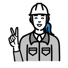 笑顔でピースサインをしているヘルメットをかぶった現場作業員の女性