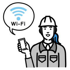 スマートフォンを持ってWi-Fiの説明をしているヘルメットをかぶった現場作業員の女性
