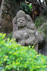 Fototapeta na wymiar The old stone Buddha statue.