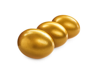 Many shiny golden eggs on white background