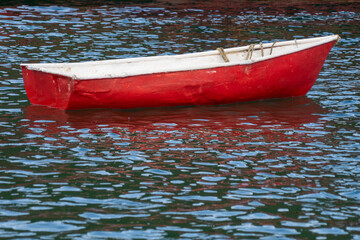 red canoe on the sea