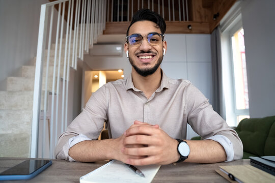 Man looking at camera pass job interview distantly by videoconference app