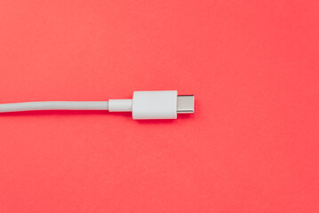 USB cable type C over orange background