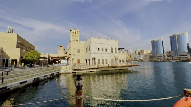 Scenic View Of Al Seef Waterfront In Dubai Creek With Cityscape In UAE. Dolly Shot