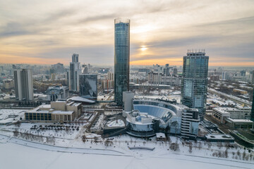 Fototapeta na wymiar Yekaterinburg aerial panoramic view in Winter at sunset. Yekaterinburg city and pond in winter.