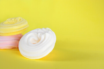 White meringue with shadow on yellow background