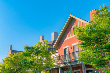 Terrace of a house with coral pink exterior and gray trims at Daybreak, South Jordan, Utah