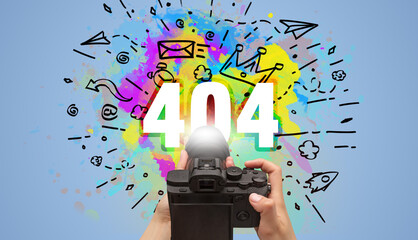 Close-up of a hand holding digital camera with abstract drawing