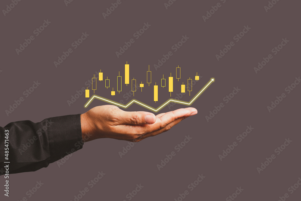 Poster the stock financial graph and digital increasing line graph on the palm.