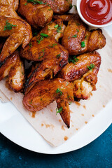Closeup Barbecue chicken wings on white background. Top view.