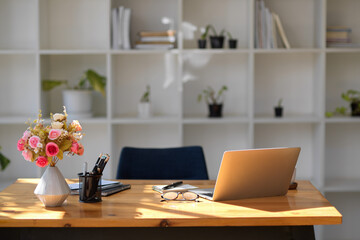 A modern office workplace interior with wooden office desk