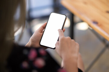 A smartphone blank screen mockup on woman's hand. close-up.