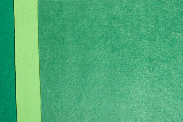 Fototapeta premium The background is made of felt in three shades of green