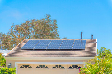 Solar panels on top of the garage roof with vents in Laguna Niguel in California