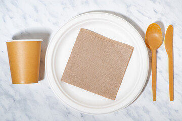 eco-friendly disposable tableware made from recycled materials, top view