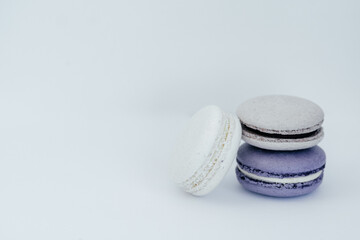 purple gray and white macarons on a white background fresh and delicious dessert