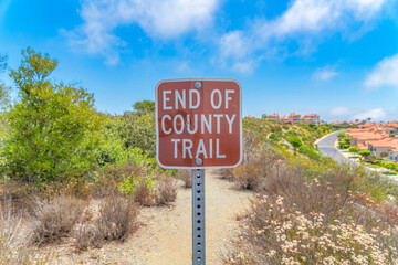 Signage in a dirt trail on the mountain at Laguna Niguel in California