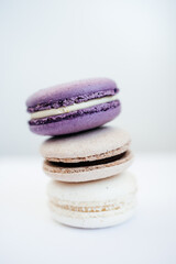 purple gray and white macarons on a white background fresh and delicious dessert