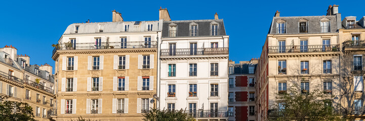 Fototapeta na wymiar Paris, typical facade, beautiful building, with old zinc roofs rue Saint-Ambroise 