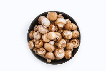 top view of fresh  mushrooms in bowl on white background