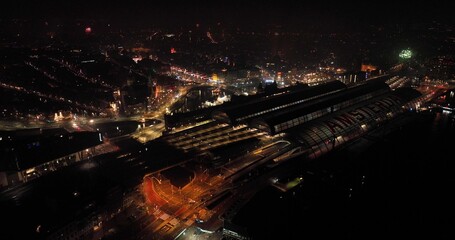 Fototapeta na wymiar New years eve in Amsterdam, The Netherlands, fireworks at night aerial drone view over the city.