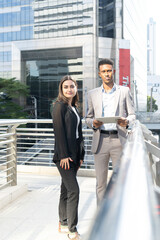 Group of business people.Business people meeting talking and sharing their ideas in city. Business team and teamwork concept. Business people standing outside in the city discussing about new project.