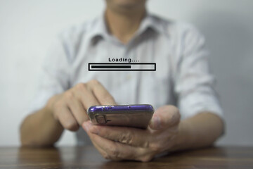 Close up of Businessman hand holding mobile smartphone with cloud upload to store data on server..