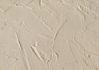 beige textured decorative stucco background with place for text